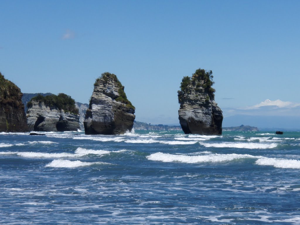 Tongaporutu Three sisters, White Cliffs and Mt. Taranaki (Mt. Egmont) in the background